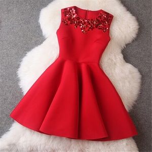 Red beaded dress in size 2.